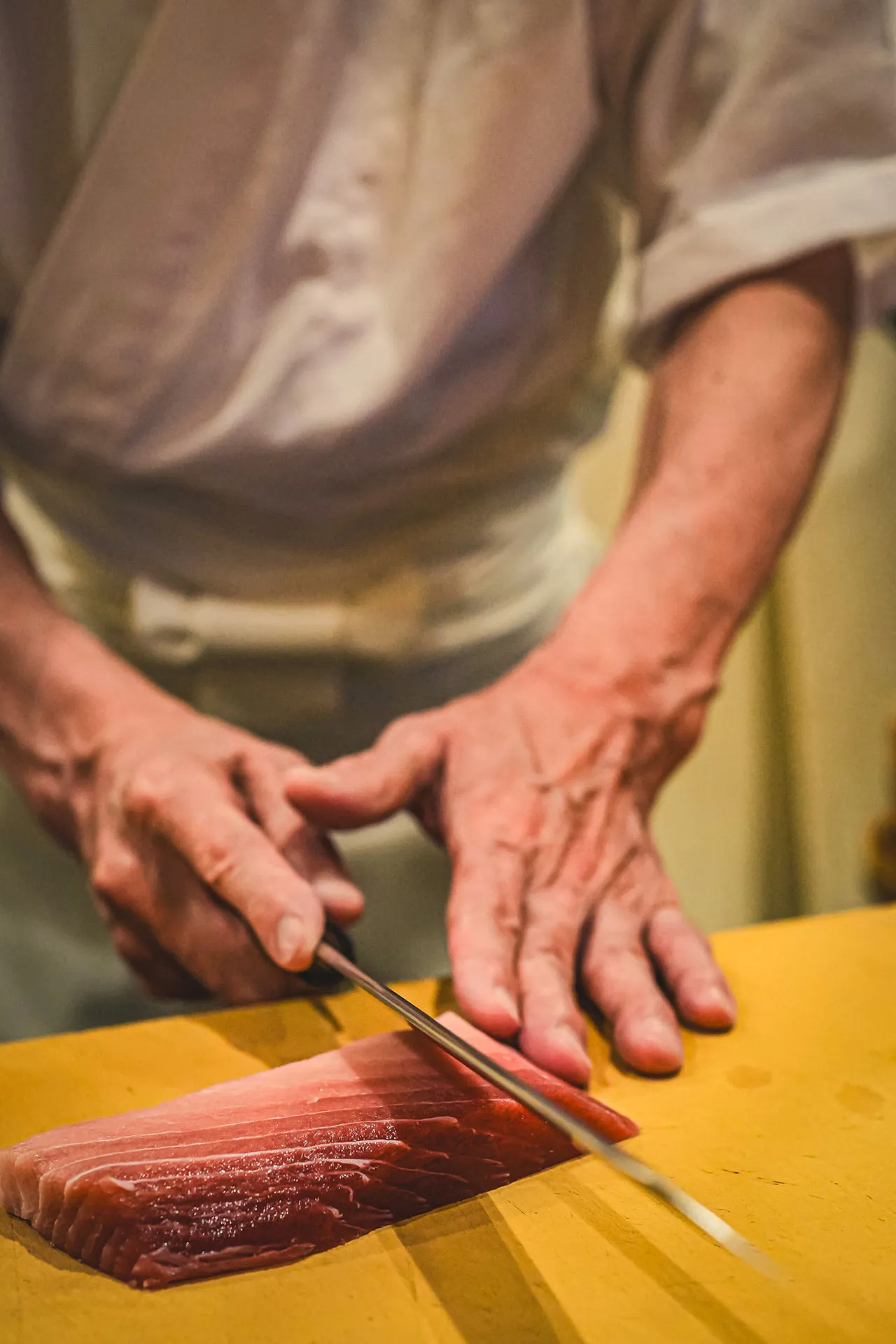 Training on the preparation of fish for sushi