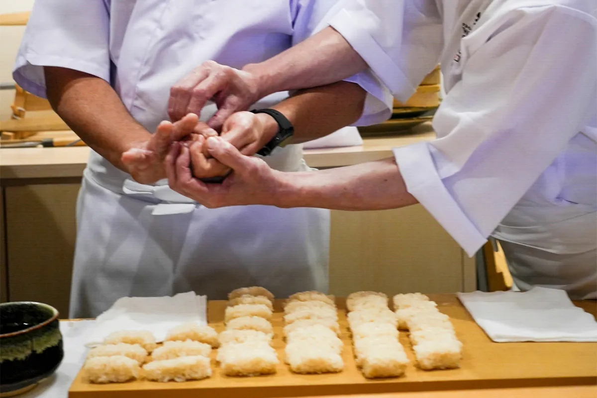 Training on shaping sushi rice