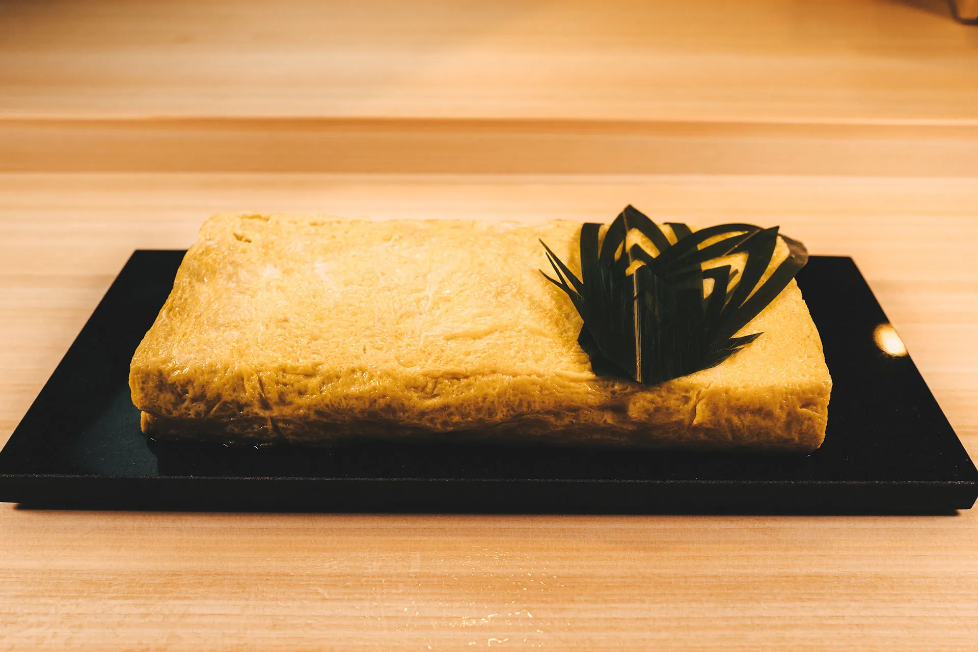 Making tamagoyaki (Japanese rolled omelette)